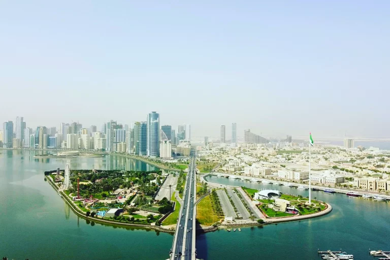 Aerial view of Flag Island and Khalid Lagoon with skyline buildings in Al Majaz Sharjah UAE