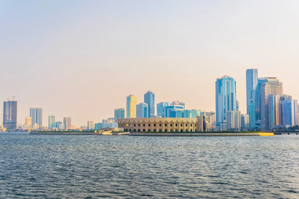 Panorama view of Khalid Lagoon with Al Majaz Amphitheater and surrounding skyscrapers in Sharjah UAE