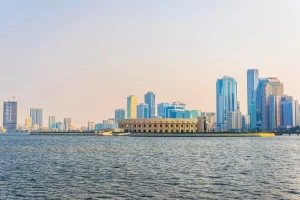 Panorama view of Khalid Lagoon with Al Majaz Amphitheater and surrounding skyscrapers in Sharjah UAE